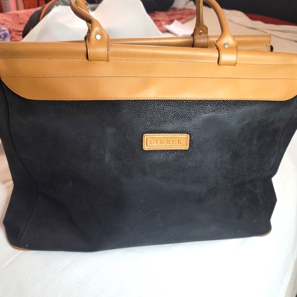 X-T.R.A.C.K Handbags - ONLY DUE TO CLOSET CLOSURE     LEGITIMATE BAG.  LEATHER.